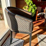 Pair of Art Deco barrel chairs in black and bronze
