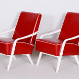 Red Leather mid Century Armchairs made in 1950s Czechia. Restored beech.