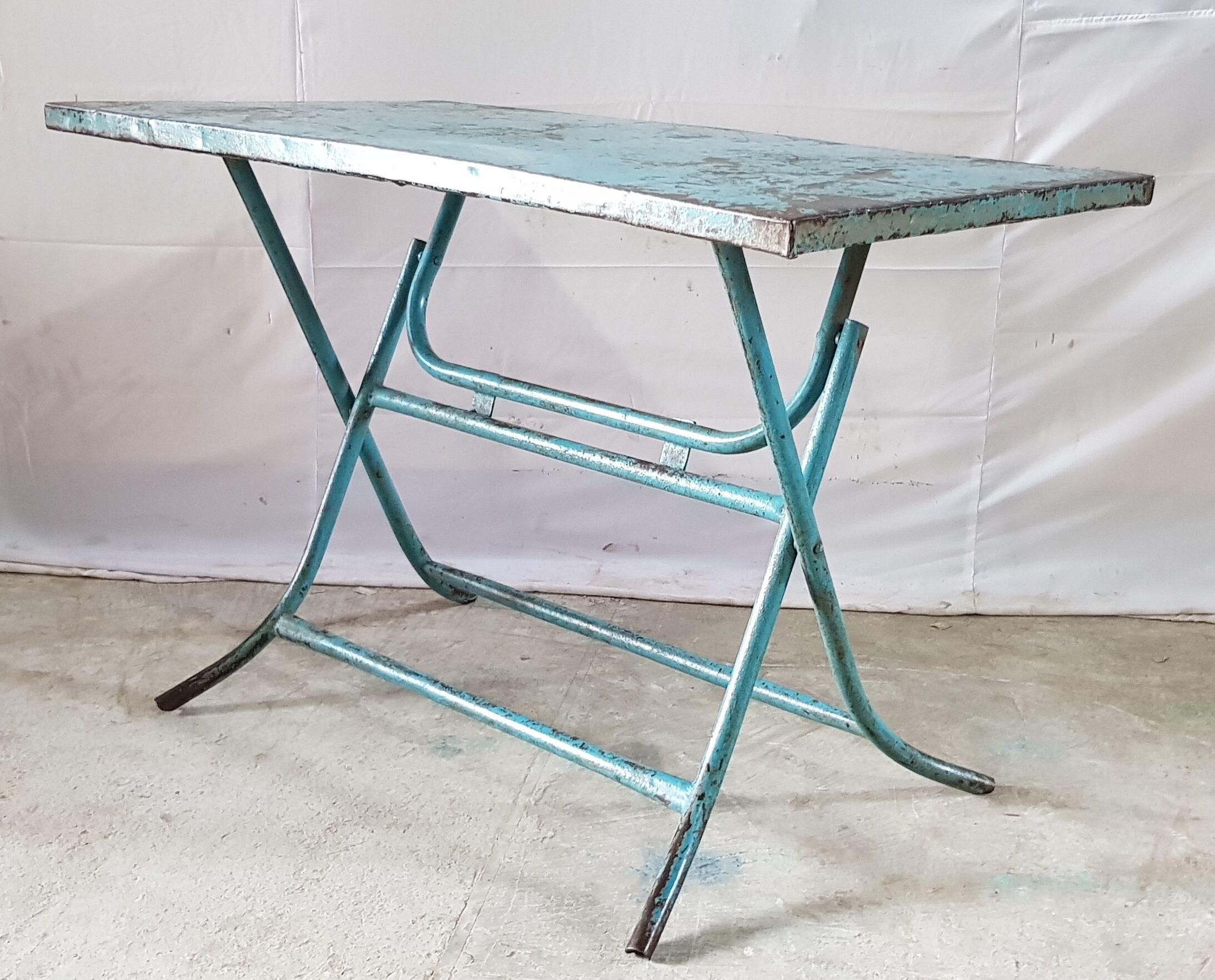 Old metal folding table with its original turquoise patina