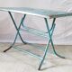 Old metal folding table with its original turquoise patina