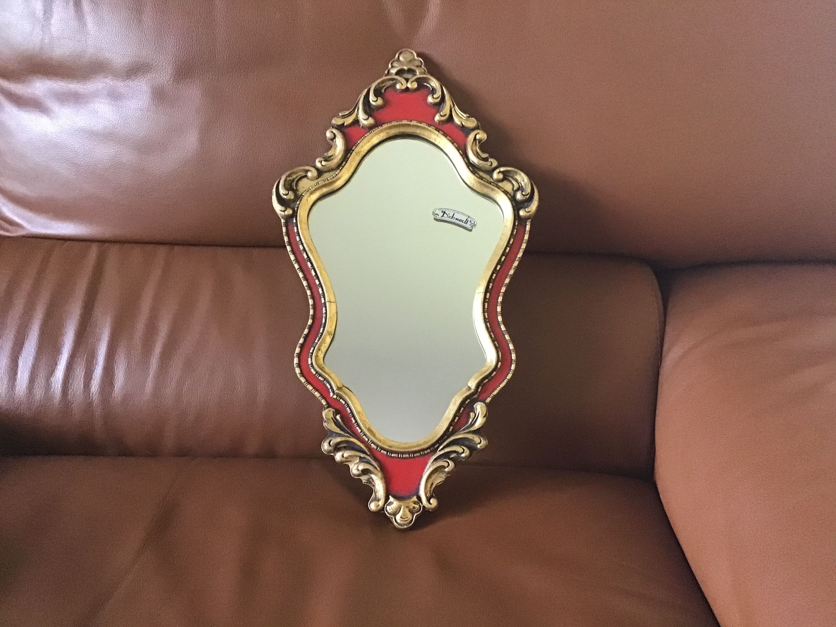 Gold and red mirror brand Deknudt