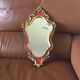 Gold and red mirror brand Deknudt