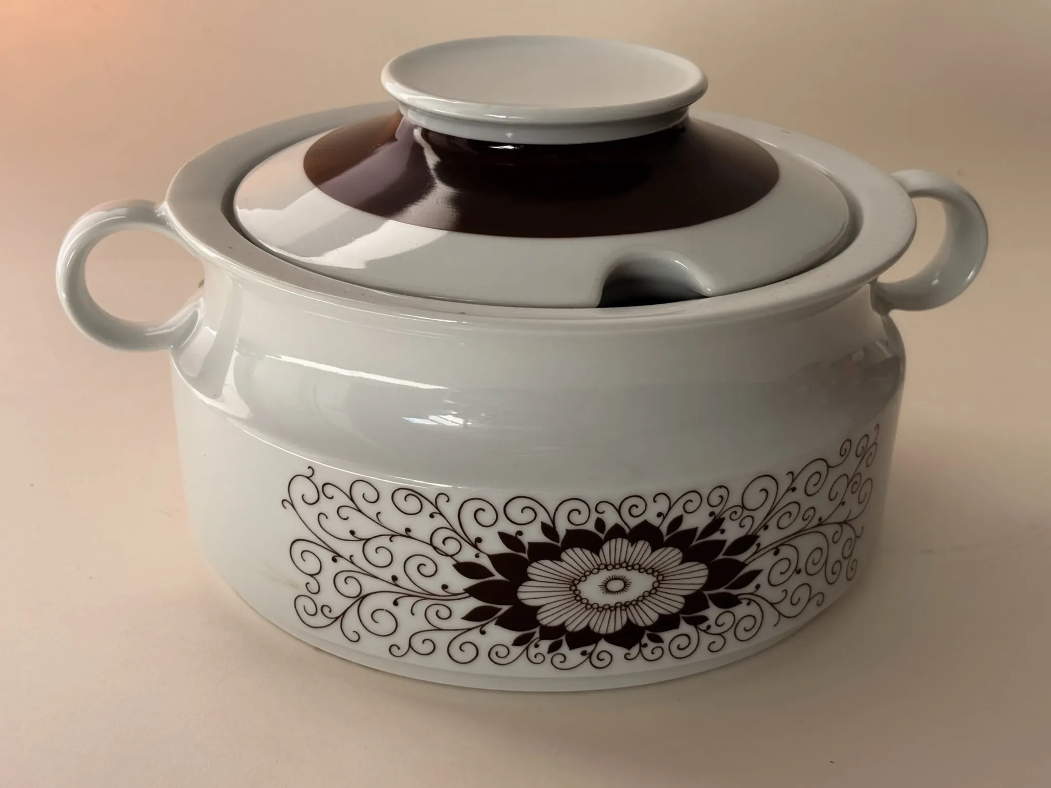 Porcelain soup tureen by Winterling, decorated with brown flowers.