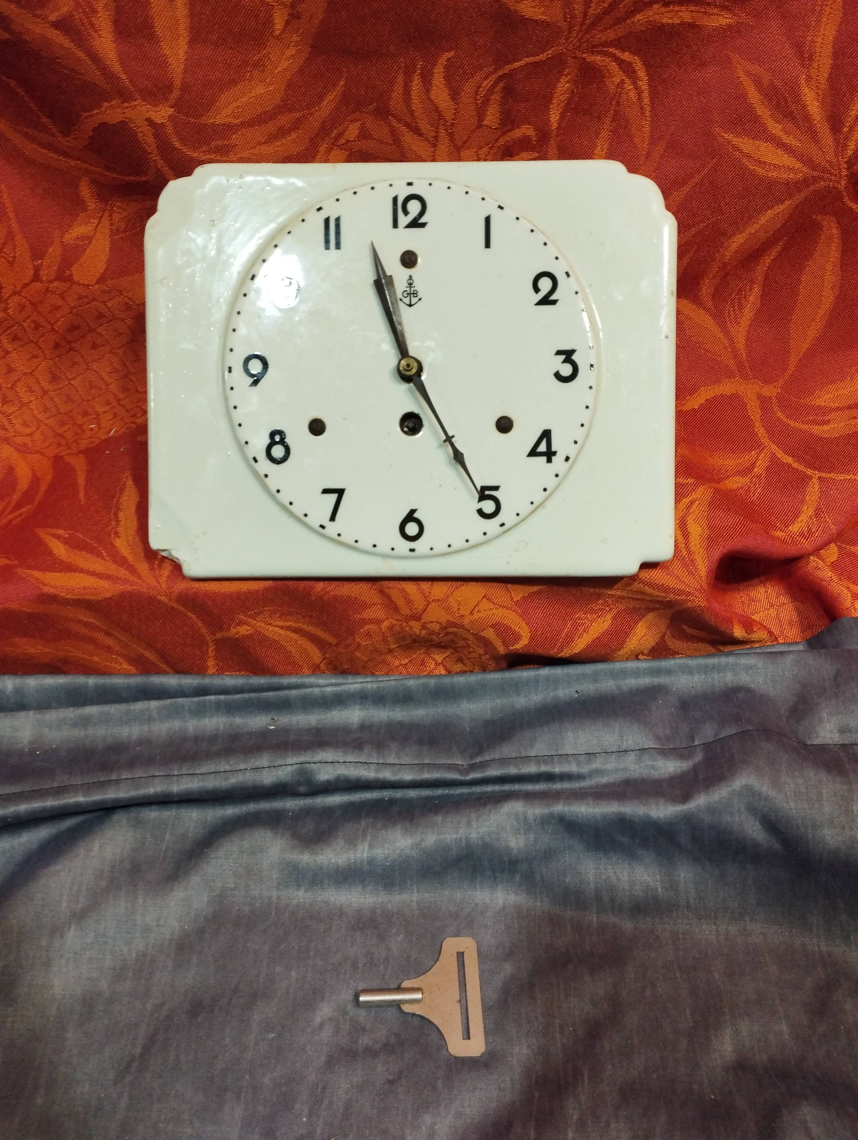 Small white art deco earthenware wall clock