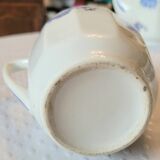 Blue and white ceramic coffee service with flowers.