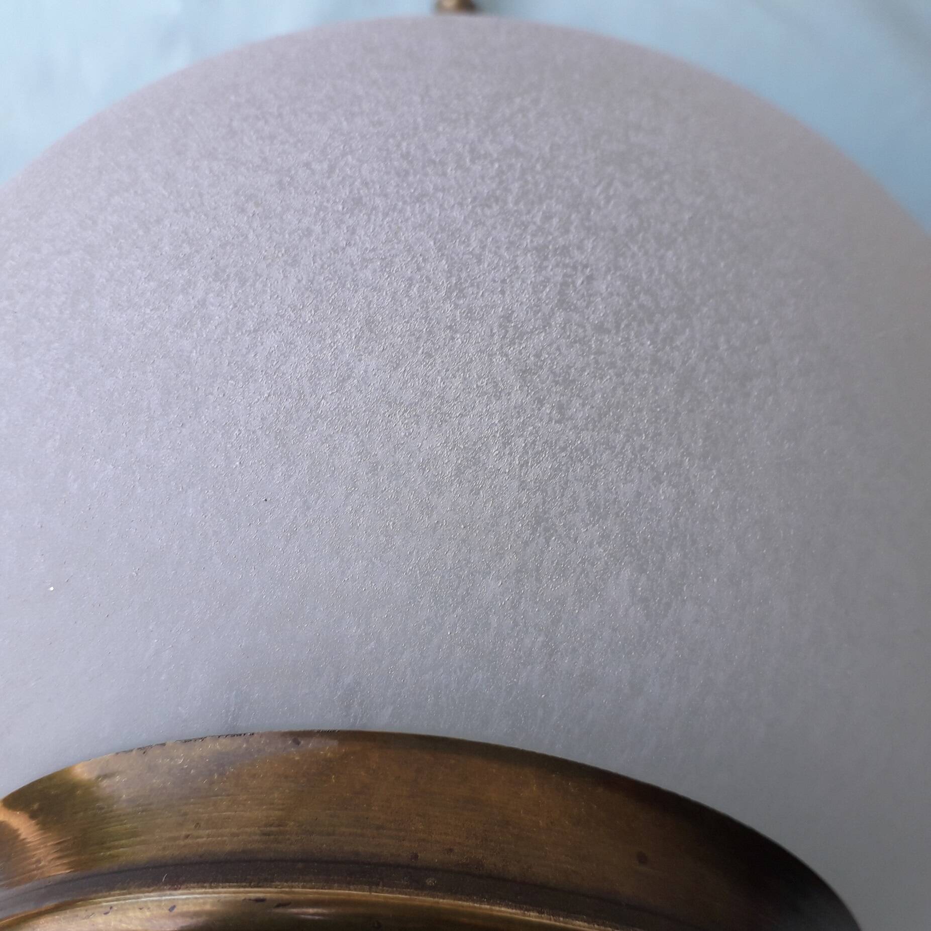 Glass and brass suspension