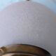 Glass and brass suspension