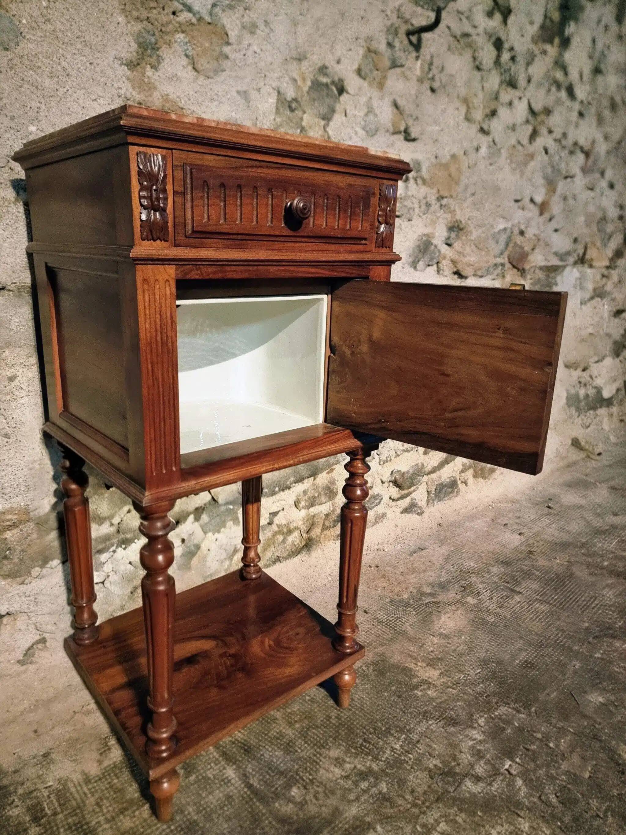 Antique French bedside table with a marble top.