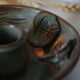 Pair of cellar rat candle holders in glazed sandstone