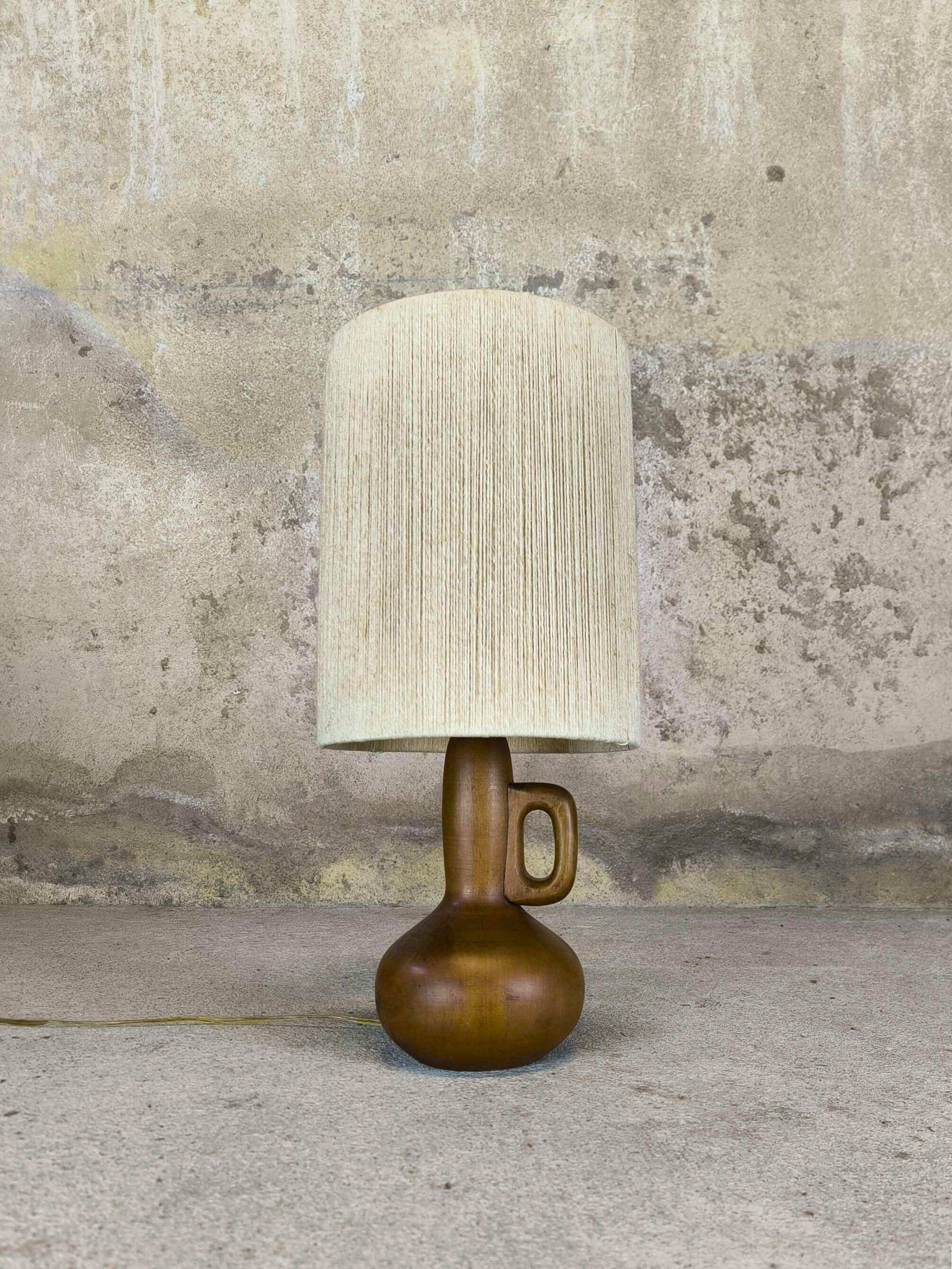 Vintage wooden table lamp with a wool shade.