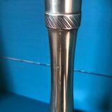 Large candlestick in chiseled brass