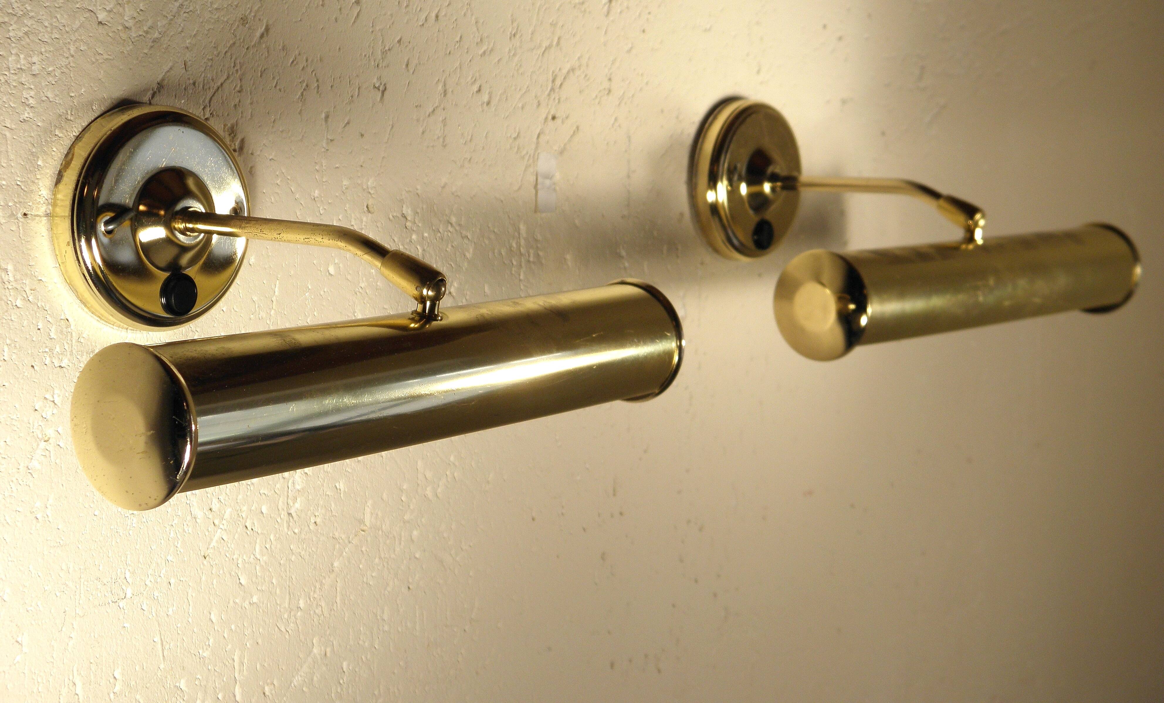 Two gold metal picture sconces