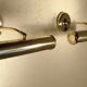 Two gold metal picture sconces