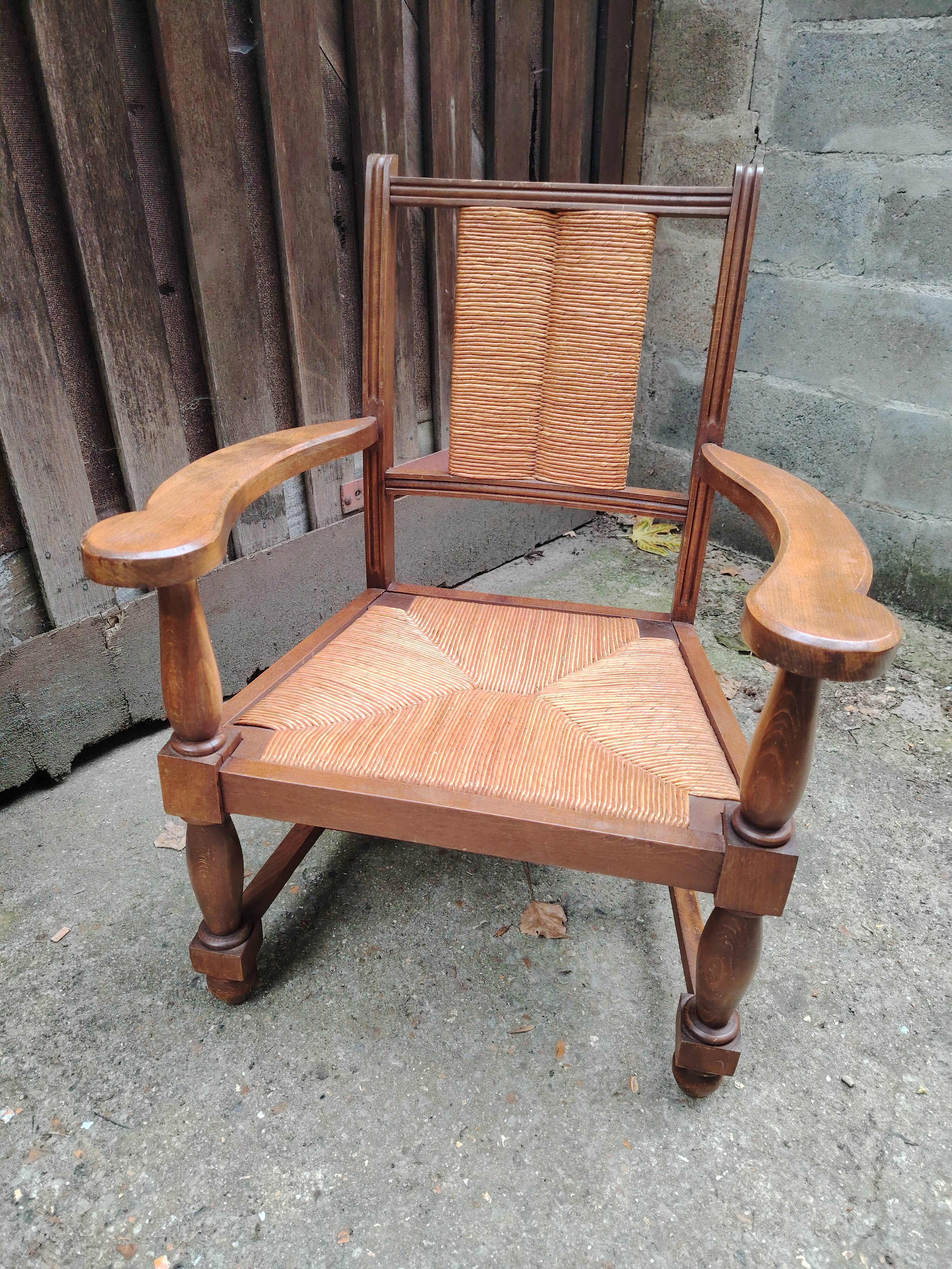 Solid wood and straw armchair