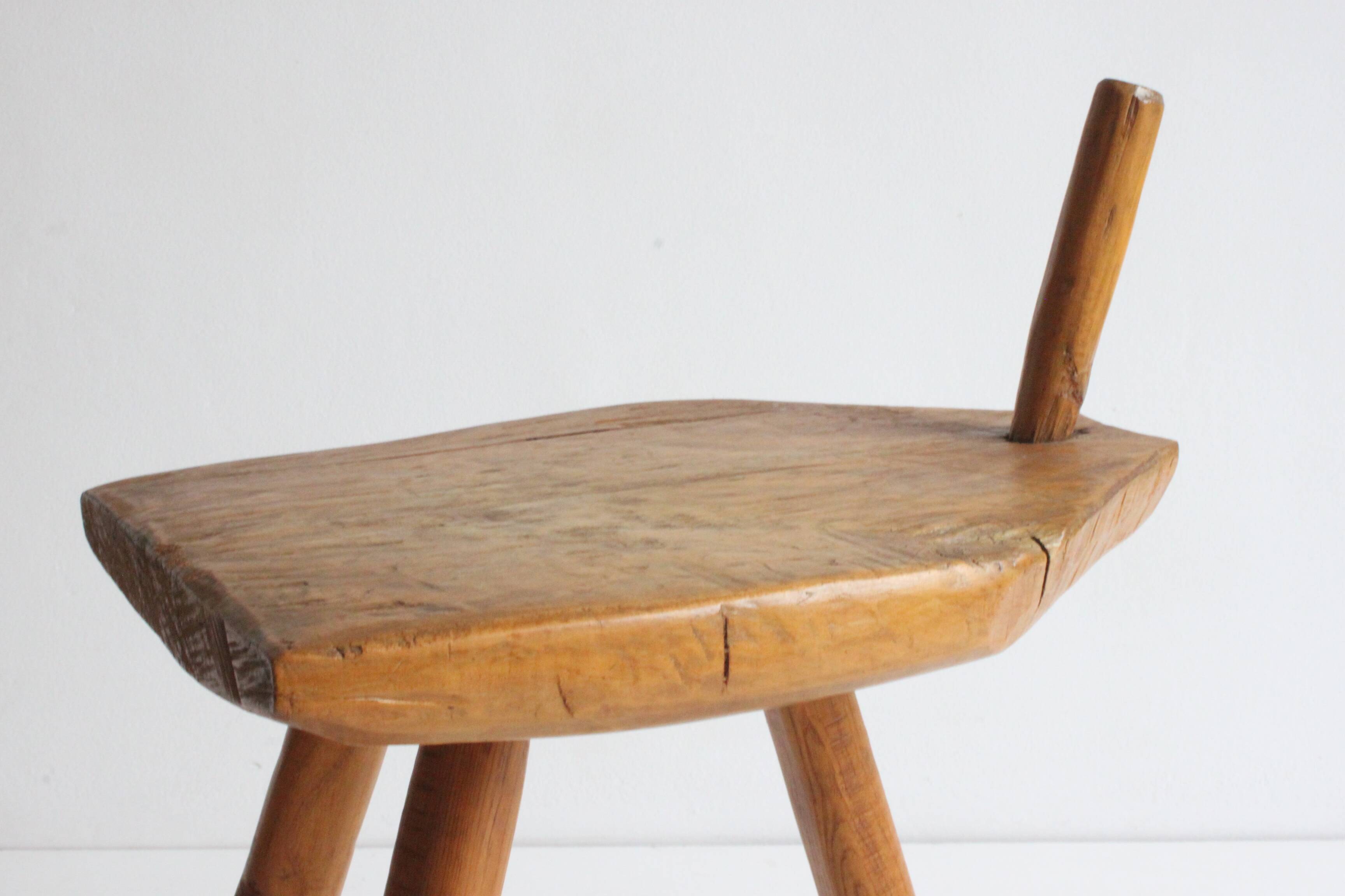 Brutalist tripod stool in carved wood, 1950s