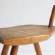 Brutalist tripod stool in carved wood, 1950s