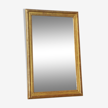 Gilded wooden mirror with beaded molding - 70x46cm