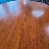 Baumann style round table with integrated extensions from the 70s