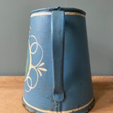 Old pitcher or milk jug in painted sheet metal
