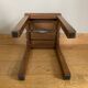 Wooden stool with central grip, quadripod base, 20th century