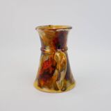 Beautiful ceramic pitcher in fire colors