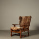 Brutalist oak lounge chair and ottoman in original goat hide, 1960s