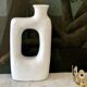 White ceramic heart vase