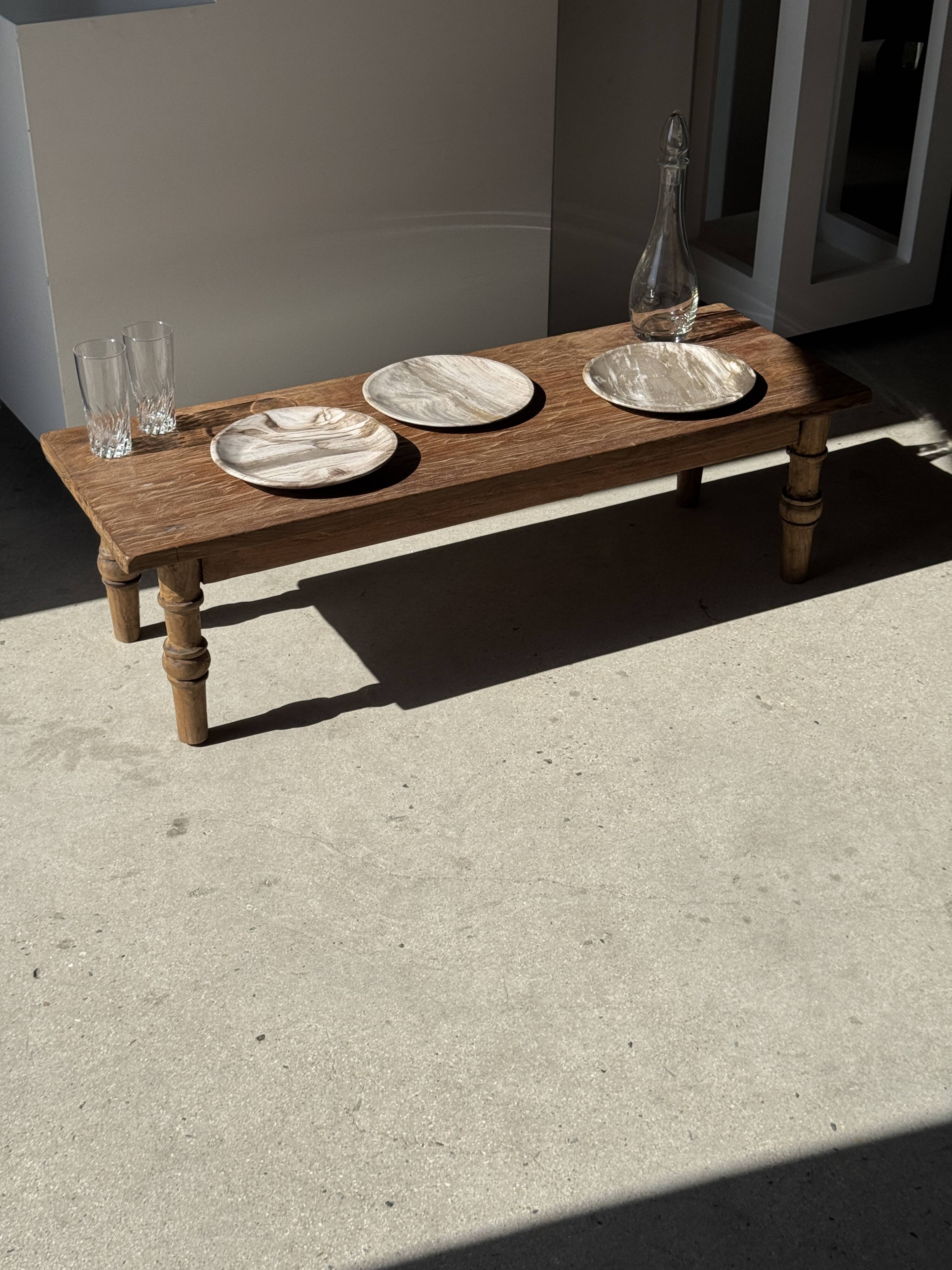 Tray, circular dish or plate made of white striped grey petrified wood.