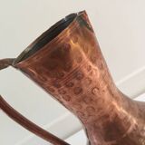 Pitcher-shaped vase in hammered copper