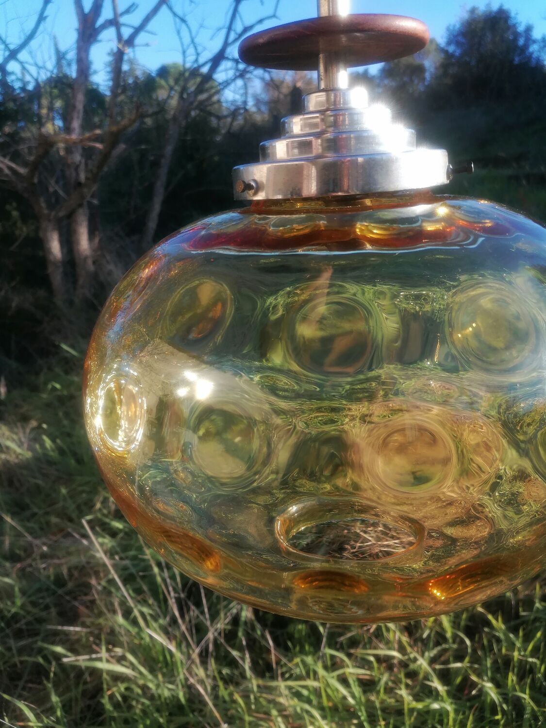 Vintage suspension ball in amber glass