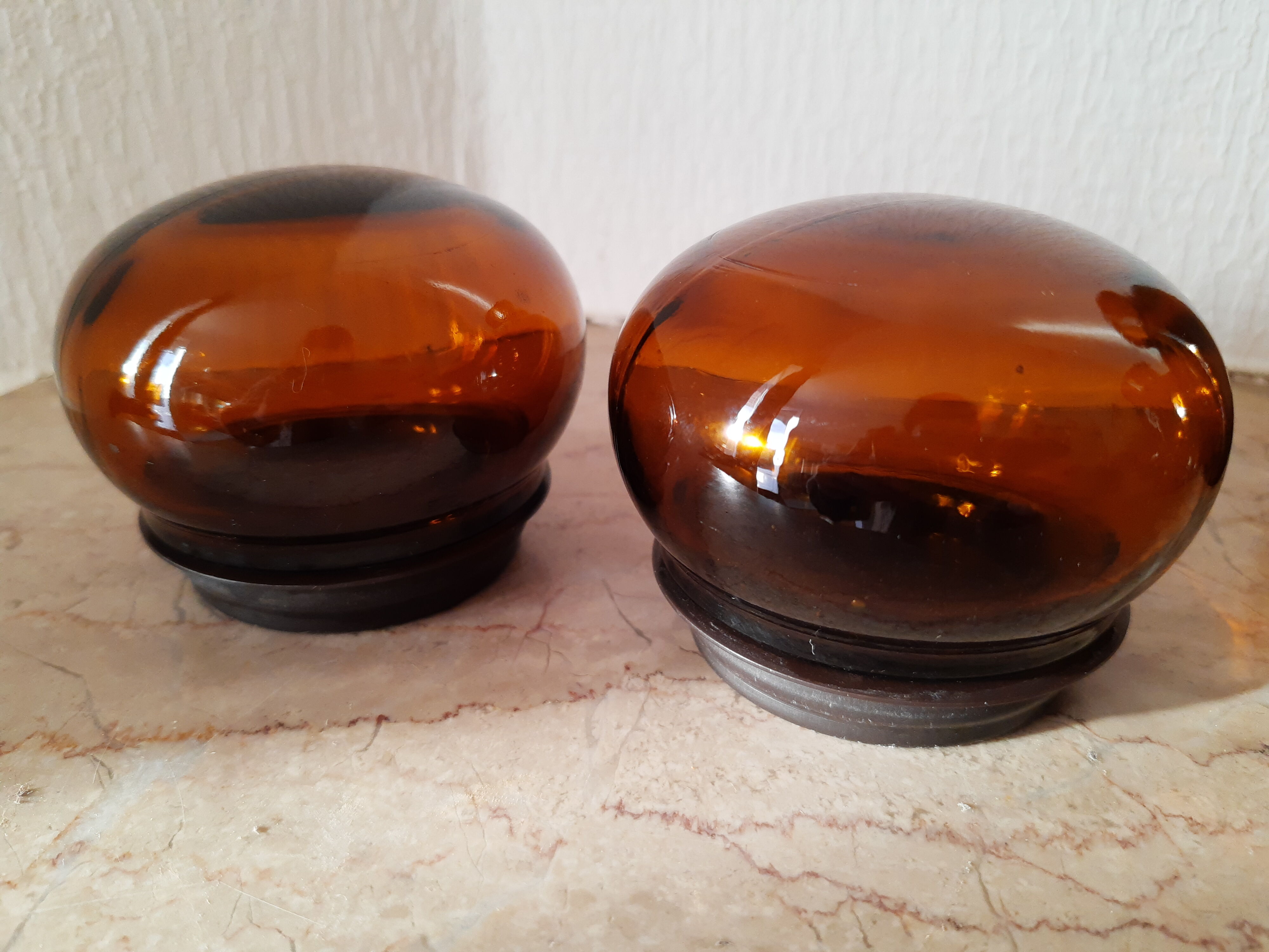 Pair of vintage amber glass jars