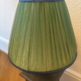 Vintage stone lamp with green pleated shade.