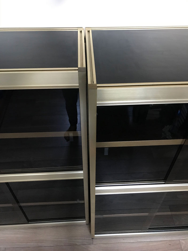 Shelves of black and gold windows