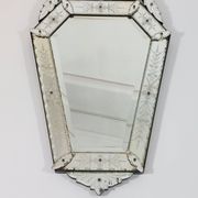 Venetian wall mirror in Murano glass with faceted floral decoration from the 1930s.