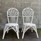 Pair of white peacock rattan chairs, circa 1960