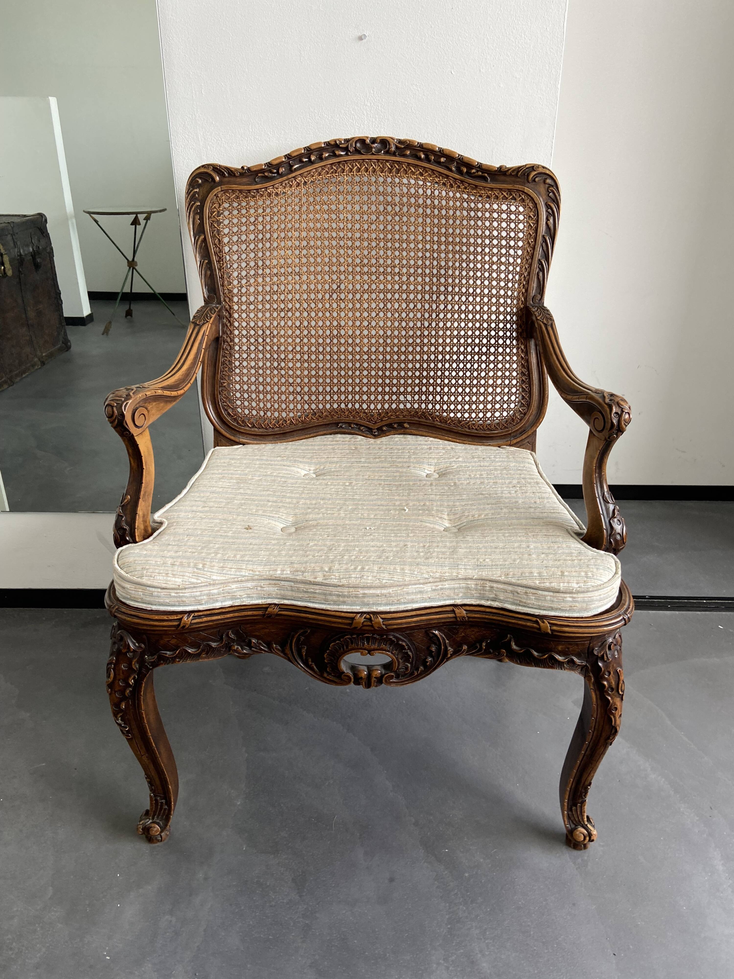 Regency canned armchair in carved walnut