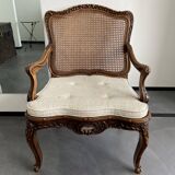 Regency canned armchair in carved walnut