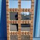 Old Burmese teak mirror with copper fittings