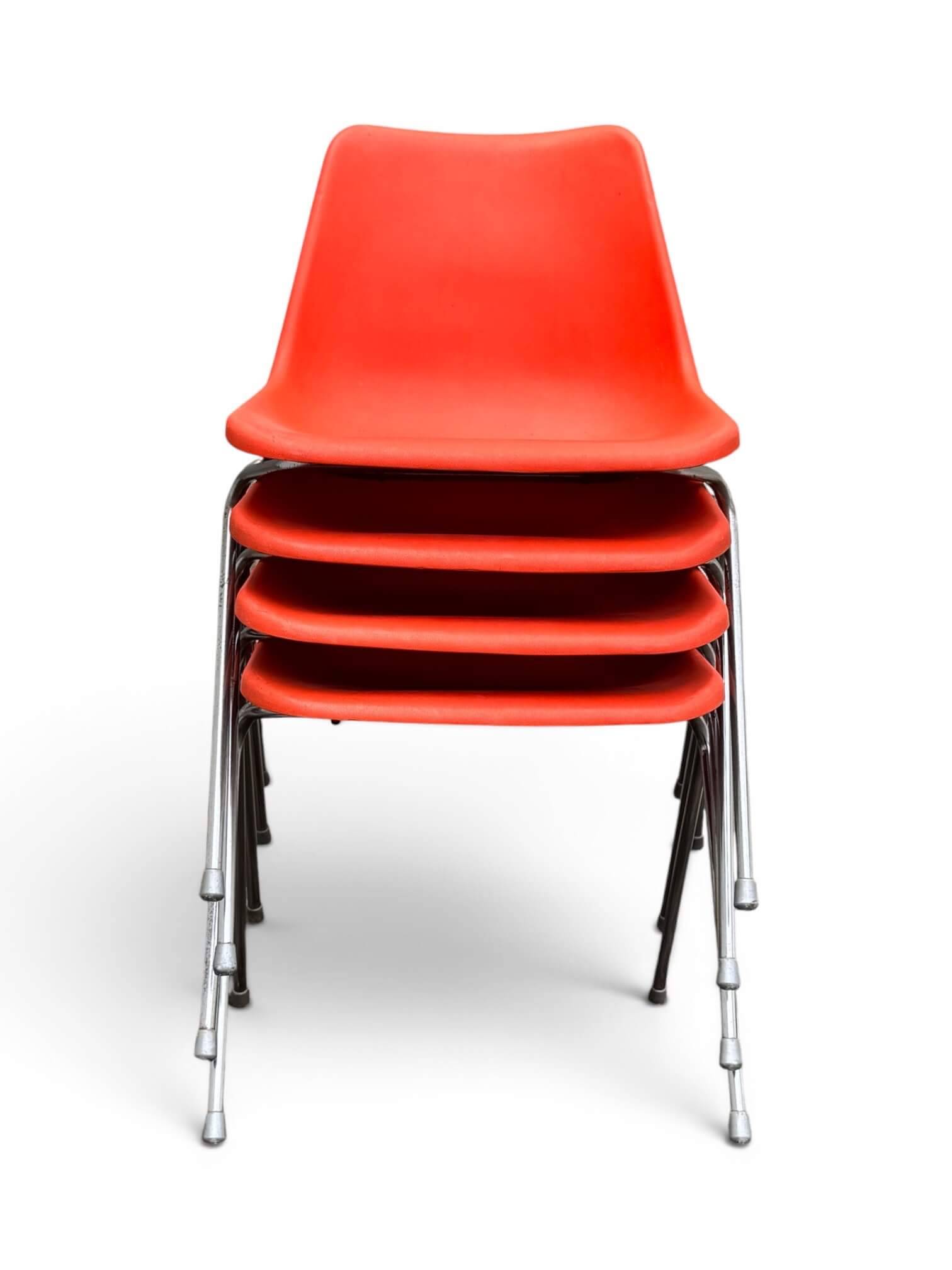 Set of 4 orange chairs designed by Robin Day for Hille.