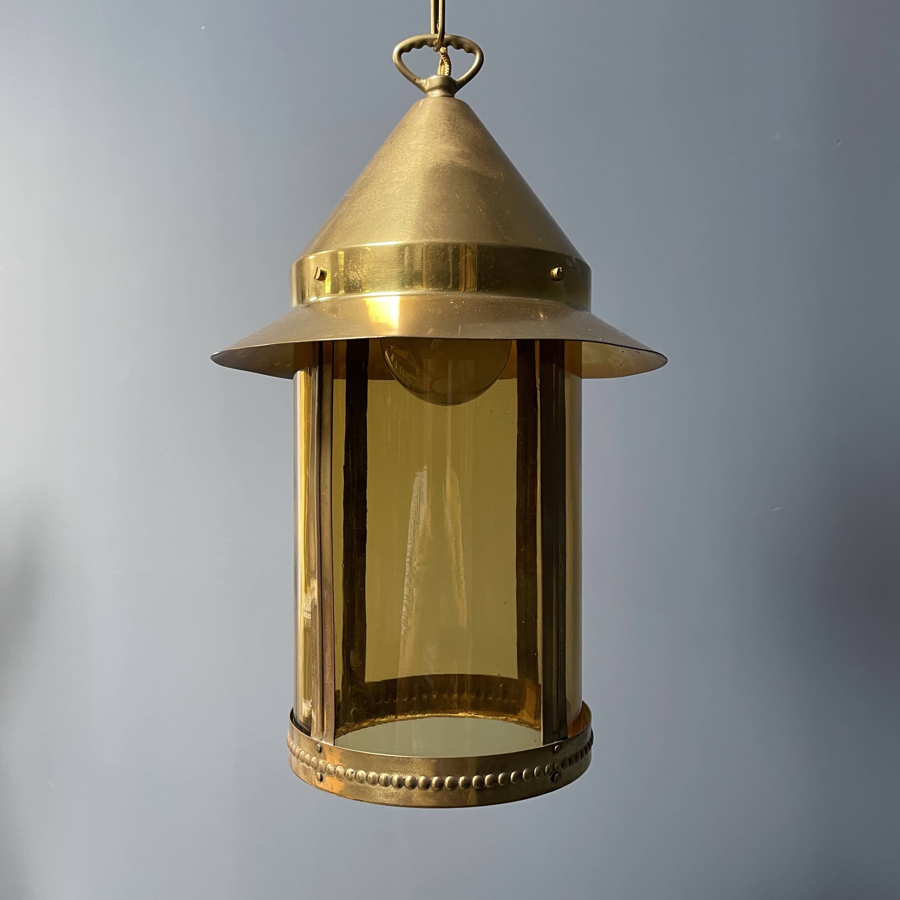 Brass lantern pendant lamp with yellow glass