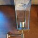 Antique lantern wall light in solid brass and glass.