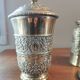 Pair of antique chiseled metal candy boxes
