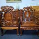 Pair of Asian armchairs in carved wood with mother-of-pearl inlays.