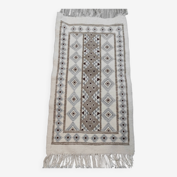 White rug with hand-woven Berber patterns