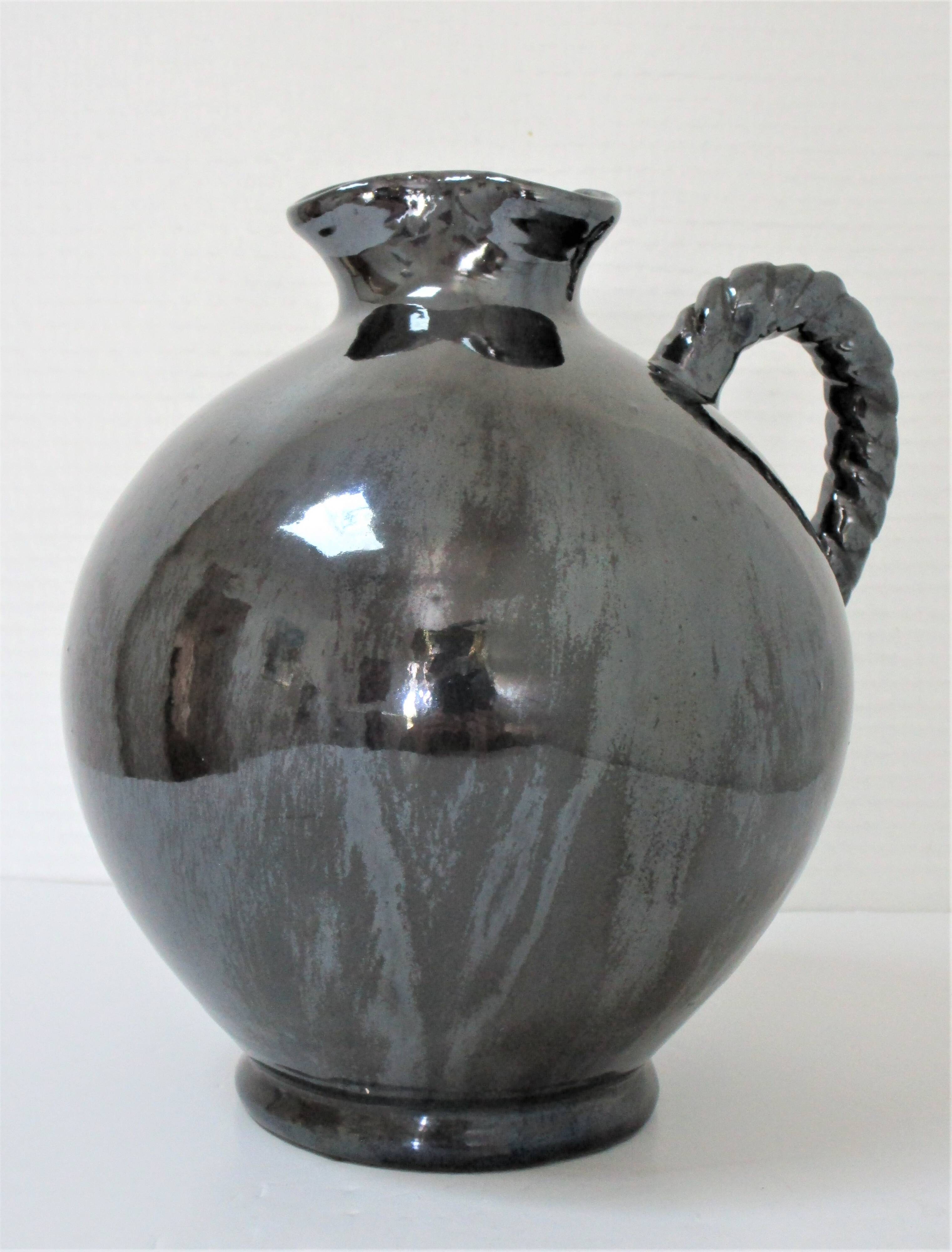 Black pearl glaze ceramic pitcher by Reinhold Rieckmann signed