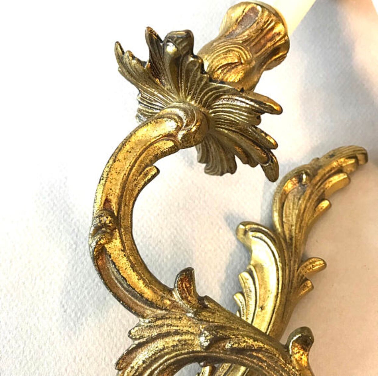 A pair of rococo gilded wall lights