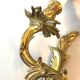 A pair of rococo gilded wall lights