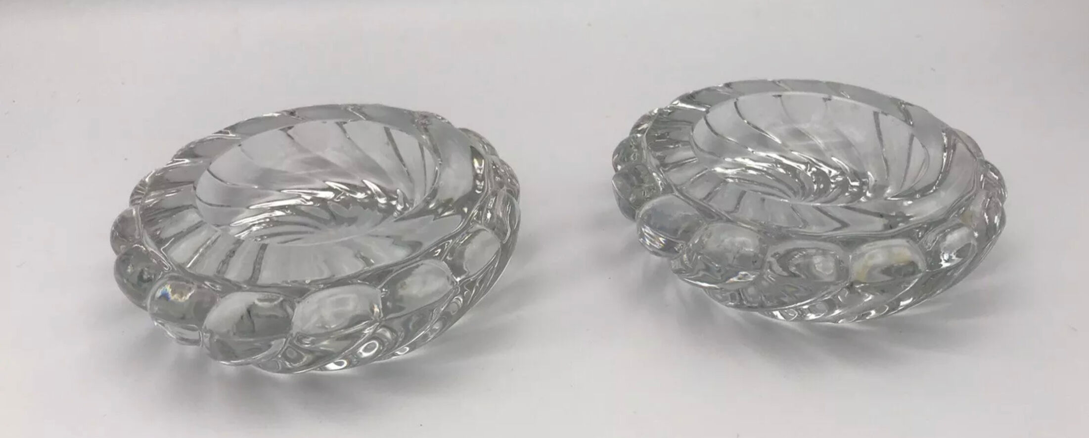 Pair of twisted round candlesticks in baccarat crystal stamped