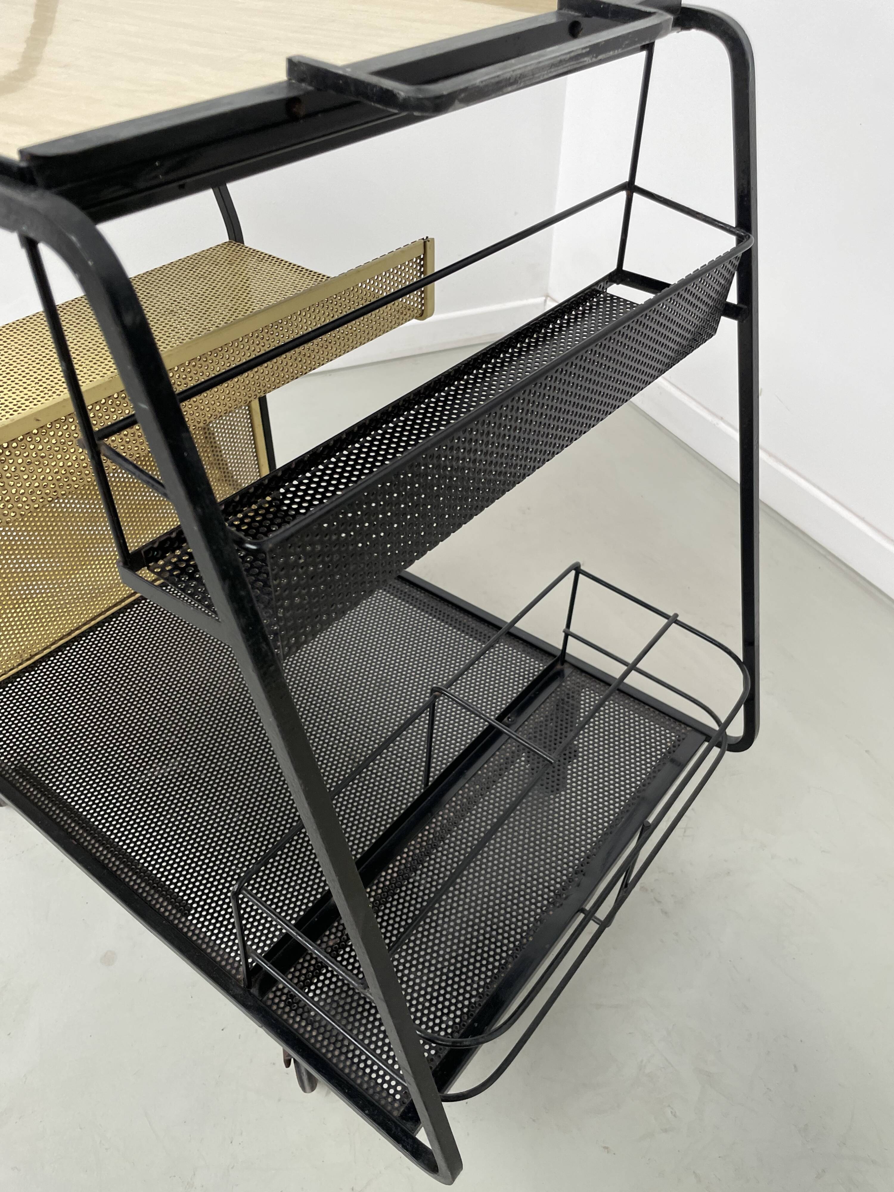 Perforated metal serving trolley in the Mathieu Matégot style