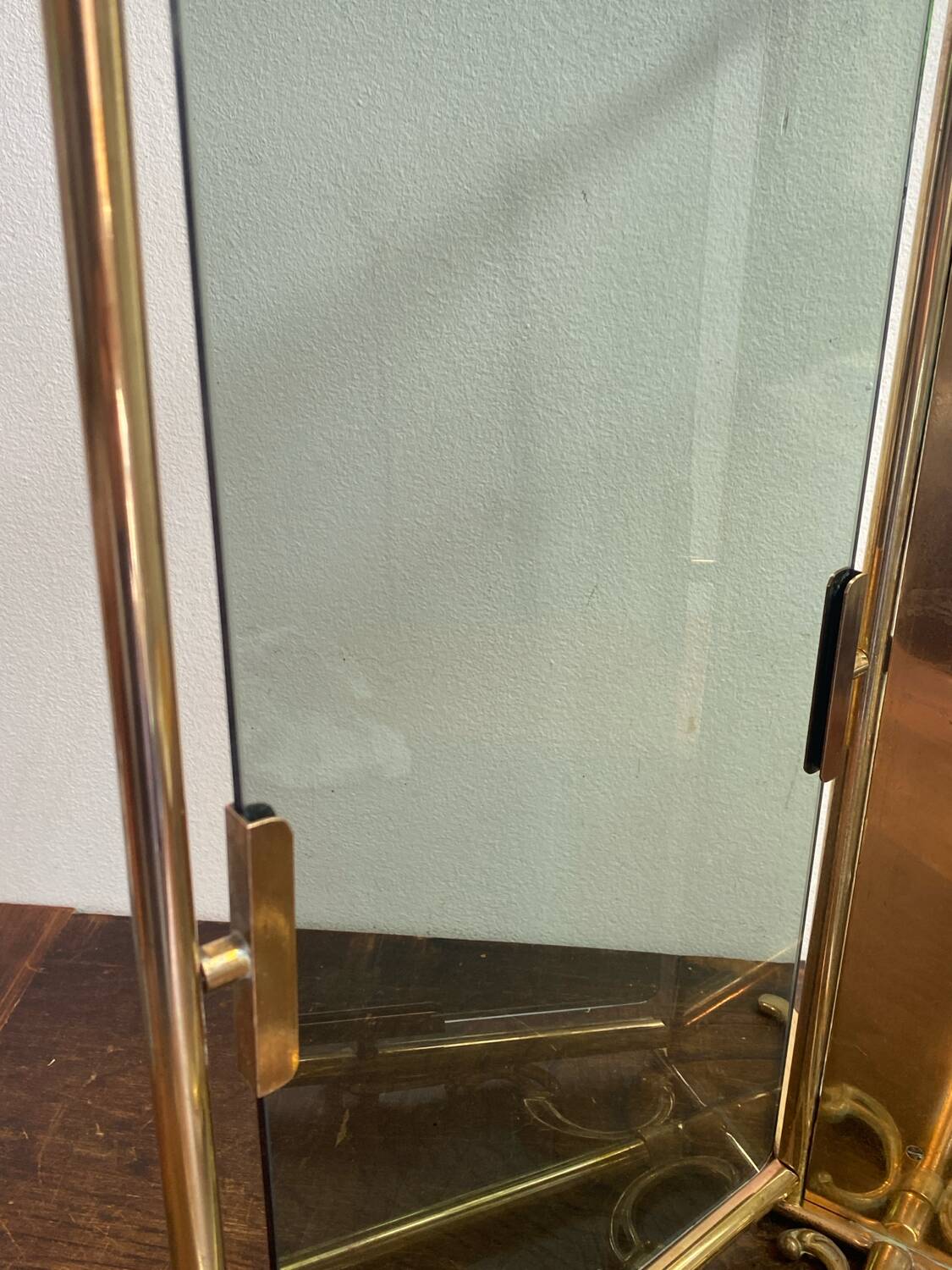 Brass magazine rack and blue-tinted glasses, 1950s.